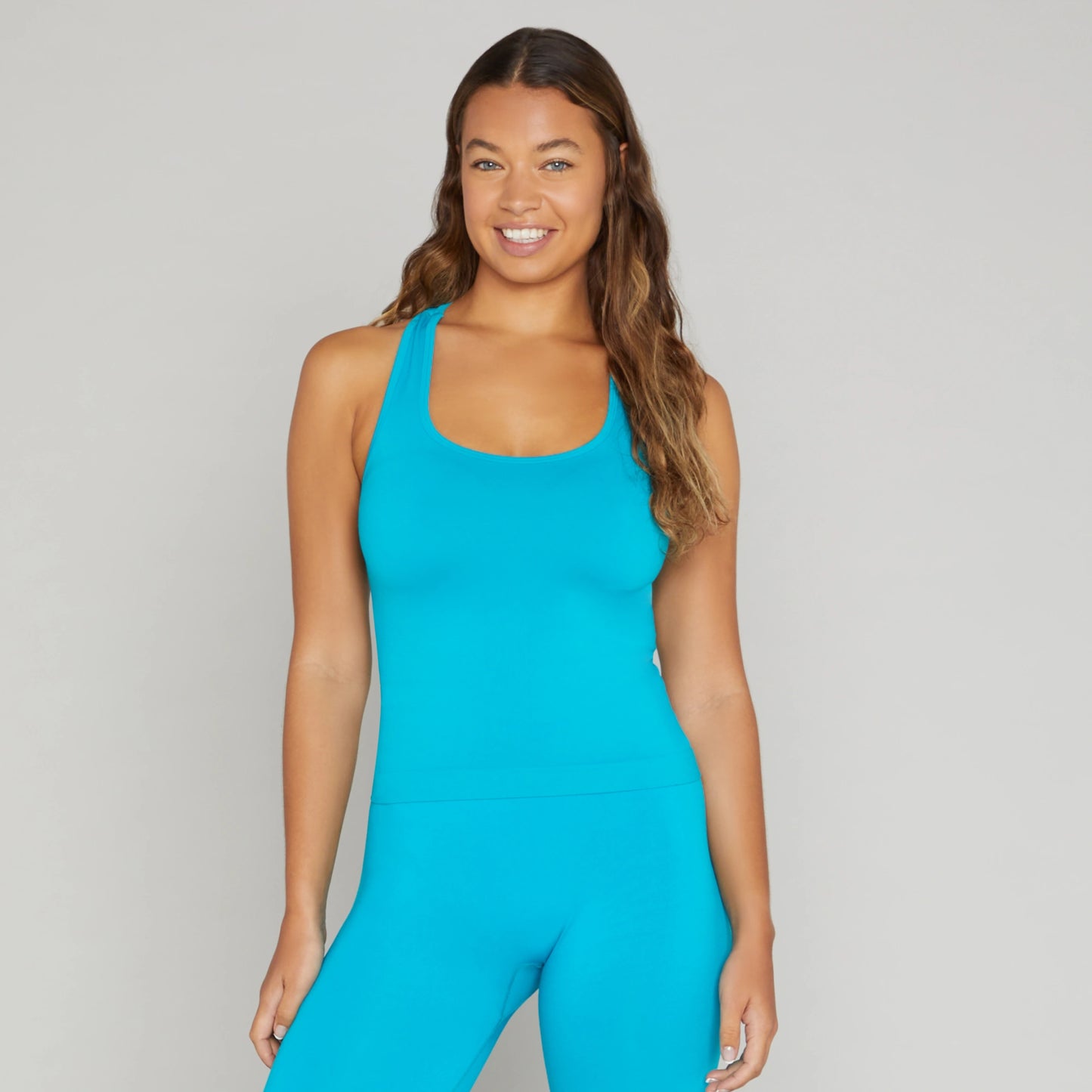 Correndo Women's workout outfit with racer back detail, Sleeveless gym top with Sculpted, supportive, soft touch, four way stretch with anti-bacterial and quick dry finish. the perfect gym top for women.