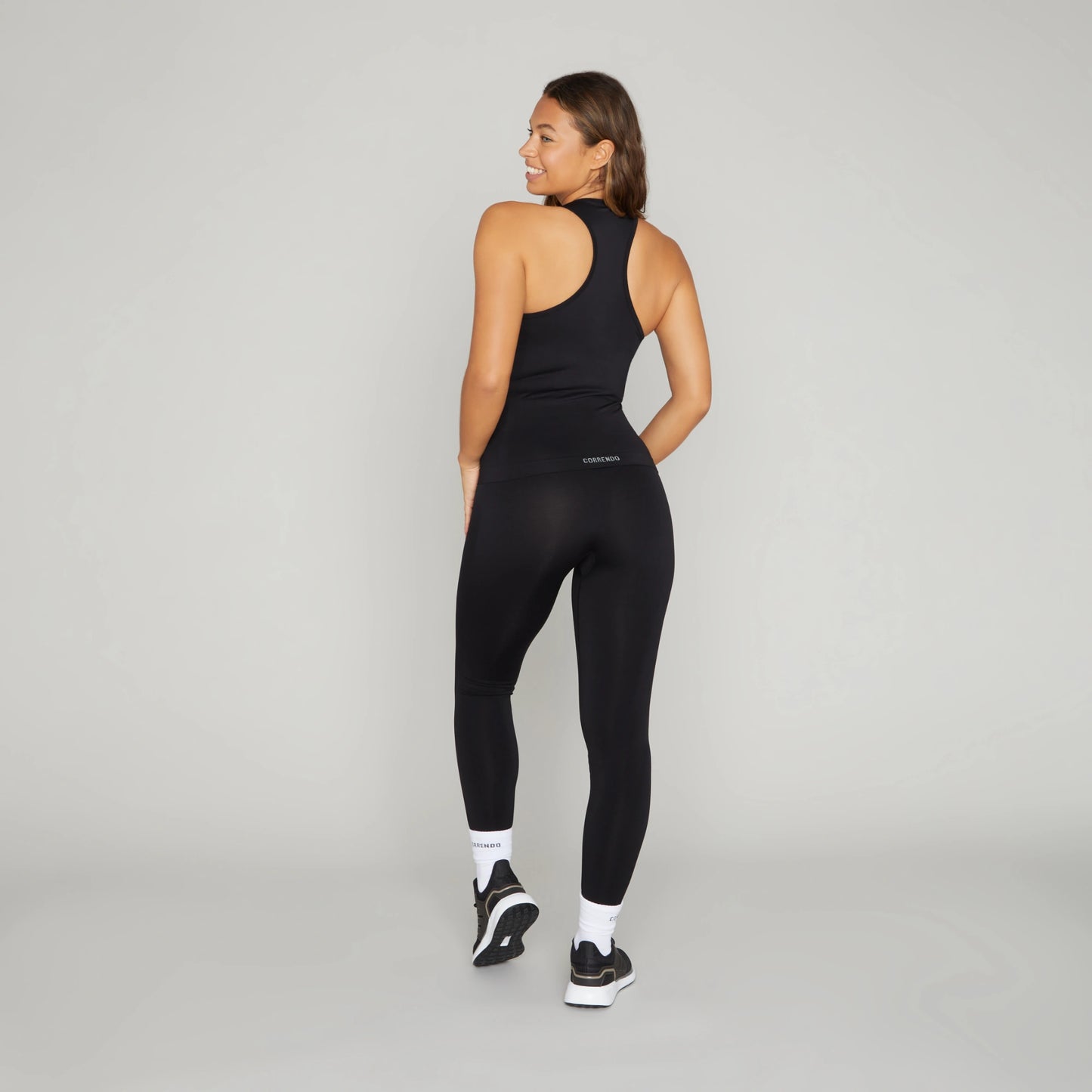 Correndo Women's workout outfit with racer back detail, Sleeveless gym top with Sculpted, supportive, soft touch, four way stretch with anti-bacterial and quick dry finish. the perfect gym top for women.
