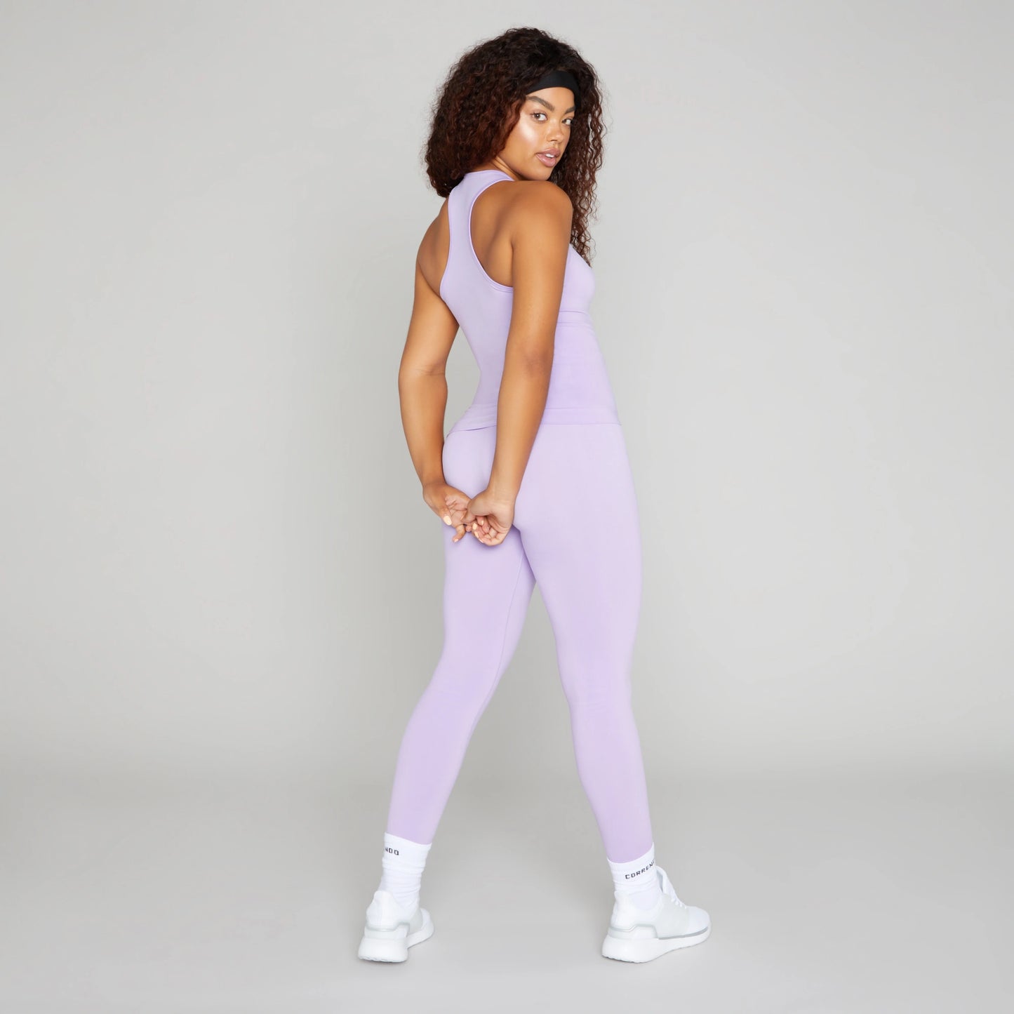 Correndo Women's workout outfit with racer back detail, Sleeveless gym top with Sculpted, supportive, soft touch, four way stretch with anti-bacterial and quick dry finish. the perfect gym top for women.
